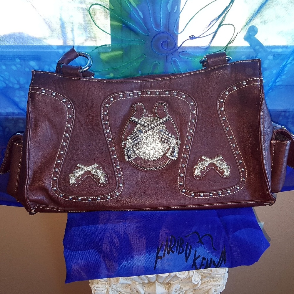 Montana West purse. Six shooter guns & rinstones